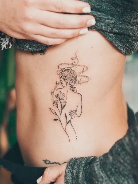 In this particular tattoo, the wearer has Tattoo Ideas With Meaning, Feminine Tattoo Ideas, Tattoo Hip, Rib Tattoos For Women, Tattoo On Hand, Self Love Tattoo, Silhouette Tattoos, Tasteful Tattoos, Healing Tattoo