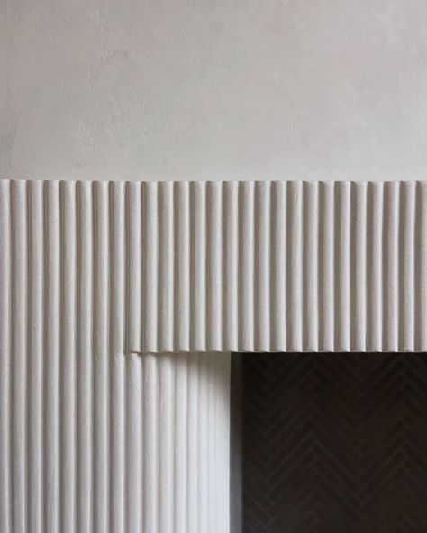 Kamp Studios on Instagram: “Fresh from the oven ♨️ Fluted and textural plaster features, one of many in this stunning project. #plasterbykamp” Fluted Concrete Wall, Fluted Marble Fireplace Surround, Diy Fluted Fireplace Surround, Fluted Fireplace, Fluted Plaster, Becki Owens Design, Textured Plaster, Plaster Texture, Marble Fireplace Surround