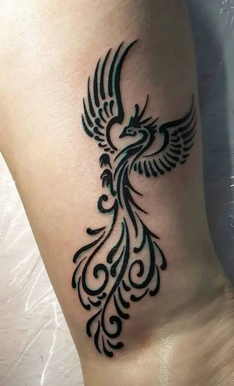 Find 57 completely unique, exclusive, and eye-catching phoenix tattoo designs in our article. Bonus: all explained meanings. Phoenix Henna Tattoo Design, Henna Phoenix Tattoo, Phoenix Tattoo Design Feminine Leg, Phoenix Henna Design, Phönix Tattoo Women Arm, Simple Phoenix Tattoo For Women, Celtic Phoenix Tattoo, Phoenix Henna, Small Phoenix Tattoos Simple