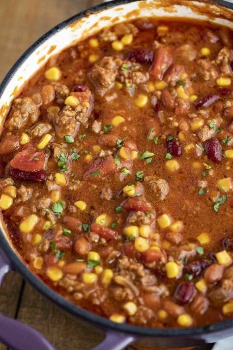 Easy Taco Soup made with ground beef, tomatoes, corn, beans, and seasoning is the PERFECT way to enjoy the taco flavors you love in a one pot dinner! #soup #tacosoup #easy #beef #groundbeef #stovetop #mexicanrecipes #mexican #dinnerthendessert Taco Pasta Soup Ground Beef, Spicy Taco Soup, Hamburger Taco Soup, Ground Beef Tomato Soup, Enchilada Soup Crockpot, Simple Taco Soup, Vegetarian Taco Soup, Taco Soup Ranch, Potato Tomato Recipe