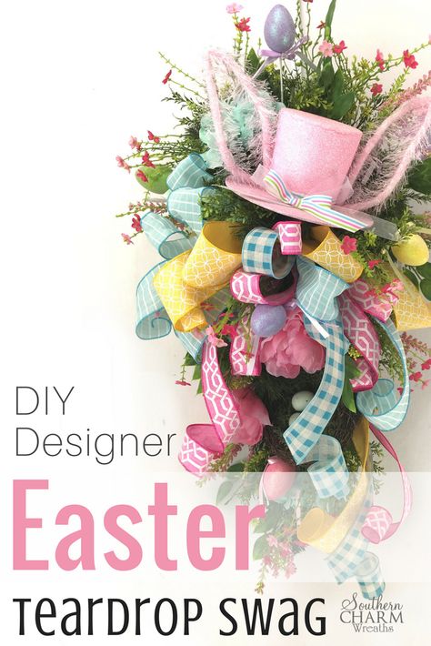 If you're looking for a wreath alternative for Easter, look no further. This designer Easter Teardrop Swag tutorial will give your door a designer look without the designer price tag! Julie shows you how to use a Christmas evergreen swag to make a spring door swag.  #easterdecor #easterswag #easterwreath #eastercrafts #teardropswag #easter #blogger Evergreen Swag, Easter Swags, Easter Mesh Wreaths, Wreath Alternative, Teardrop Swag, Easter Wreath Diy, Door Swag, Easter Door, Sell Diy