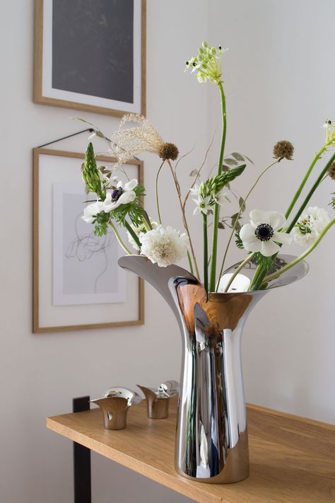 Elegant, fresh white spring flowers including anemones, scabiosa, ornithogalum styled with textural grasses and seed heads in the new, sculptural Bloom Botanica vase, designed by Helle Damkjær for Georg Jensen. #danishdesign #springflowers #georgjensen #bloombotanica George Jensen, Paid Partnership, Urban Gardens, Registry Items, From Dress, Tall Candle, Feeling Inspired, Nordic Interior, Metal Vase