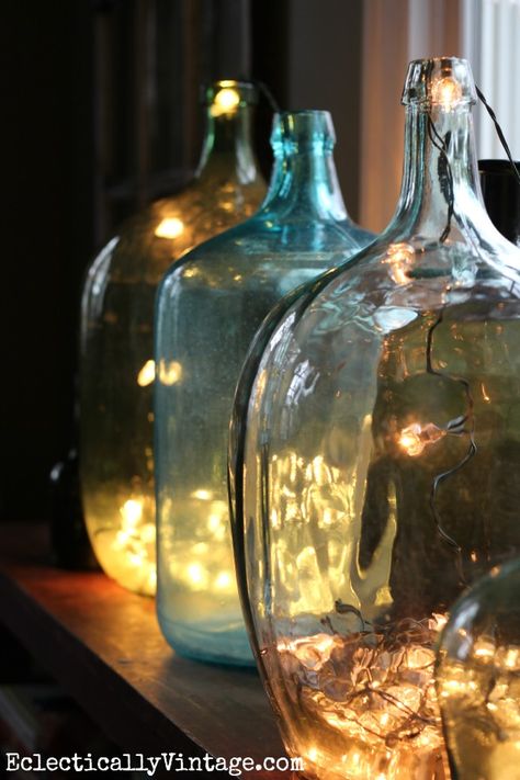 Demijohn bottles filled with string lights for Christmas kellyelko.com Christmas Lights Inside, Christmas House Tour, Deco Nature, Glass Jug, Vintage Bottles, Coastal Christmas, Christmas House, Holiday Lights, Christmas Inspiration