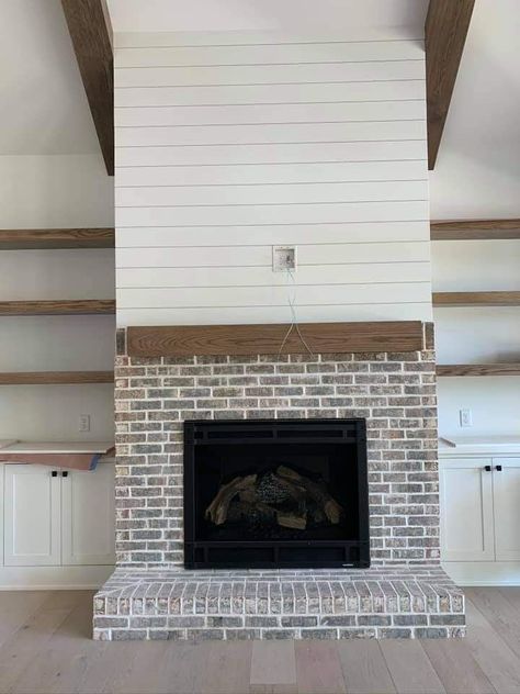 Brick Fireplace Floating Mantle, Shiplap Fireplace Brick, Brick Fireplace With Floating Mantle, Fireplace With Shiplap And Brick, Brick Fireplace Shiplap Wall, Brick Fireplace And Shiplap Wall, Floating Shelves Brick Fireplace, Half Brick Half Shiplap Fireplace, Brick Paneling Fireplace