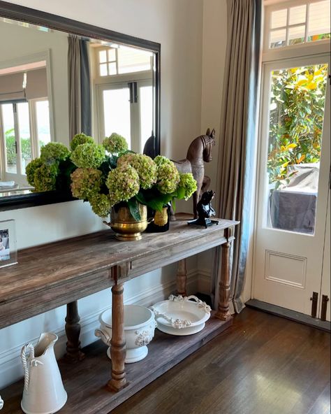 The sturdy, gracefully carved legs and refined detailing add a touch of sophistication, while the natural wood’s character ensures it remains a striking focal point in any room. Whether placed against a wall or as a centerpiece in a hallway, this console table marries functionality with beauty, making it an ideal stage for showcasing hydrangeas. Restoration Hardware Timber Console - $899 #secondhand #furniture #marketplace #smallbusiness #restorationhardware #interiordesign Secondhand Furniture, Hall Entrance, Carved Legs, Restoration Hardware, Sofa Table, Console Table, Focal Point, Natural Wood, Hallway