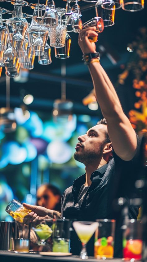 Bartender in Action: A skilled bartender reaches for a glass, preparing a drink with focus and expertise in a vibrant bar. #bartender #bar #cocktail #glassware #nightlife #mixology #drinks #service #aiart #aiphoto #stockcake https://ayr.app/l/BSTB Bartender Photoshoot Ideas, Bartender Aesthetic Male, Male Bartender, Harlow James, Bartender Photography, Bartenders Photography, Bartender Aesthetic, Lauren Blakely, Mixology Drinks