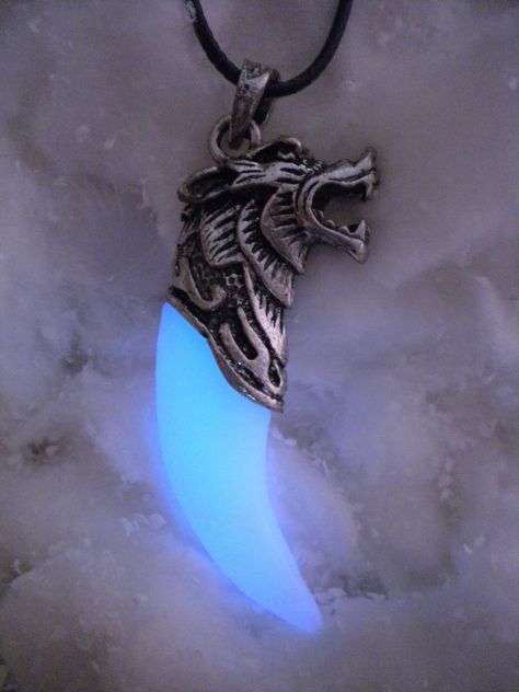 "A glowing fang of a Wolf turned into a Necklace. A symbol of his Spirit forever kept close to your heart. This is the ideal piece for any animal lover. (This is NOT a real animal fang. NO animals were hurt).  The glowing fang will hold a charge for some time after being left in the light for a few minutes. It gets more powerful if charged with real sunlight, but normal house lighting will allow it to charge as well. Keep in mind that it gets weaker over time and, after the initial high glow per Totem Necklace, Phoenix Jewelry, Wolf Tooth, Character Clothes, Phoenix Necklace, Wolf Teeth, Bff Jewelry, Pretty Knives, Dark Jewelry