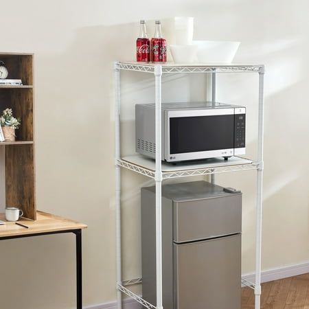 This adjustable shelving unit is designed to fit right over your personal mini fridge, maximizing the precious space taken up by this essential item. The two adjustable wire shelves let you pick the shelf height you need to store your essential supplies.Our supreme shelving from DormCo provides ever-useful sturdy storage whether it's in a college dorm room, small apartment, or office space. Features: Durable epoxy finish - Large size but still practical 2 Adjustable Shelves to hold cooking supplies or electronics with space underneath shelving for compact mini fridges No tools required for assembly - Feet can adjust for uneven flooring Metal frame minimizes dust and allows venting for electronics Overall Dimensions: 52"H x 24"W x 18"D Size: 52" H x 24" W x 18" D.  Color: White. Ikea Dorm, Mini Fridge Stand, Dorm Comforters, Dorm Fridge, Small Dorm Room, Mini Shelf, Small Dorm, Shelf Units, Dorm Supplies