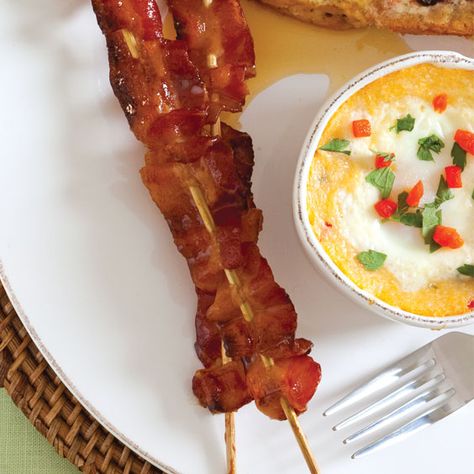 These bacon skewers are a mouth-watering delight glazed with a mixture of brown sugar and maple syrup. Maple Bacon Skewers, Bacon On A Stick Skewers, Bacon Skewers Brunch, Bacon On A Stick, Bacon Skewers, Baptism Brunch, Maple Glazed Bacon, Shower Snacks, Graduation Brunch