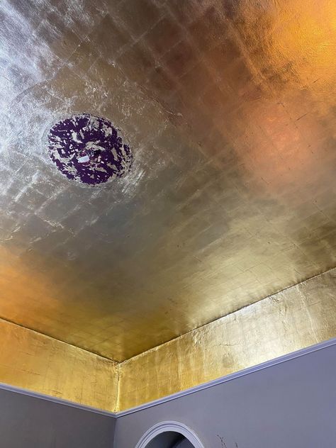 We used imitation gold leaf to create a swoon-worthy gold ceiling in our new cocktail bar. Click through to find out how. Gilded Ceiling Gold, Black Walls Gold Ceiling, Gold Ceiling Bathroom, Gold Leaf Ceiling Diy, Gold Ceiling Paint Ideas, Gold Painted Ceiling, Gold Ceiling Paint, Gold Wallpaper Ceiling, Gold Wall Paint