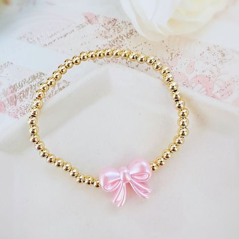 Gorgeous 14k Gold Plated 4mm Beaded Bracelet With A Pink Pearl Bow Bead Perfect Bracelet To Wear Alone Or Stacked With Other Favorite Pieces Bracelet Measures Approximately 7 Inches This Is For One Bracelet Only Tags: Preppy, Coquette, Pearls, Pink Bow, Spring Fashion, Gift For Her, Easter, Trend, Trendy, Love Shack Fancy, Stoney Clover Lane, Enewton, Mean Girls, Preppy Gold Bracelet Stack, Couqutte Jewelry, Summer Jewelry Stack, Love Shack Fancy Jewelry, Love Shack Fancy Bracelet, Preppy Brackets, Cute Party Favors For Teens, Preppy Stuff To Get For Your Birthday, Fancy Beaded Bracelets