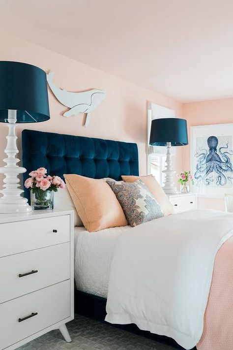 A white whale art piece hangs from a pink wall above a blue velvet tufted headboard accenting a bed complemented with white and pink bedding topped with pink and white pillows. Zimmer Diy, Blue Headboard, Hgtv Dream Homes, Hgtv Dream Home, Pink Bedrooms, Coastal Bedrooms, Room Deco, Pink Bedroom, Blue Bedroom