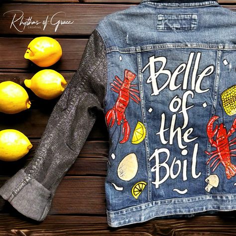 Hand-Painted Mardi Gras Jean Jacket: “Belle Of The Boil” - One Of A Kind! Introducing The Newest Addition To Our Collection: The "Belle Of The Boil" Hand-Painted Jean Jacket! Perfect For This Year's Family Crawfish Boil, This Unique, Eye-Catching Piece Will Ensure You Stand Out With Style And Flair At Any Event. Limited Stock Available, So Grab Yours Now And Be Ready To Rock The Crawfish Boil In Style! Features: - Size: Ladies Small - Brand: Express Denim Jacket - Details: Complete With All The Painted Football Jeans, Mardi Gras Jean Jacket, Custom Jean Jacket Ideas, Hand Painted Jean Jacket, Denim Painting, Denim Paint, Painted Jean Jacket, Oyster Roast, Painted Things