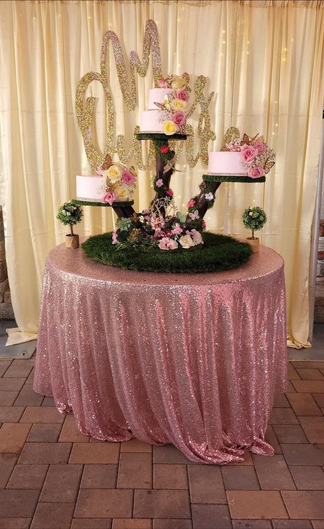 Quincenera Cake Table Ideas, Lavender Quinceanera Cake Ideas, Fairy Garden Quinceanera Theme Centerpieces, Quince Entrance Table Ideas, Pink And Green Quinceanera Theme, Quinceanera Throne, Enchanted Forest Quinceanera Cake, Quince Cakes Quinceanera, Enchanted Forest Theme Quinceanera