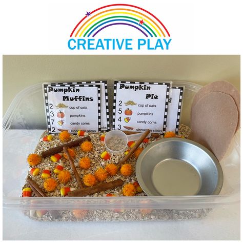 This is a October Sensory Bin I created where children can make Pumpkin Pies, Pumpkin Muffins, Pumpkin Bread and Pumpkin Cake. In the bin, I put rolled oats, orange pom poms, candy corn, cinnamon sticks, metal tins, felt pie toppers, a scoop and recipe cards. I made the recipe cards, printed them and then laminated them. Children love to bake so this gives them an opportunity to bake while using their fine motor, math skills, sensory skills and pre-reading skills. Pumpkin Pie Sensory Bin Preschool, Candy Corn Sensory Bin, Pumpkin Pie Sensory Bin, Pumpkin Patch Sensory Bin, October Sensory Bin, Pie Sensory Bin, Sped Preschool, Felt Pie, Pumpkin Pie Muffins