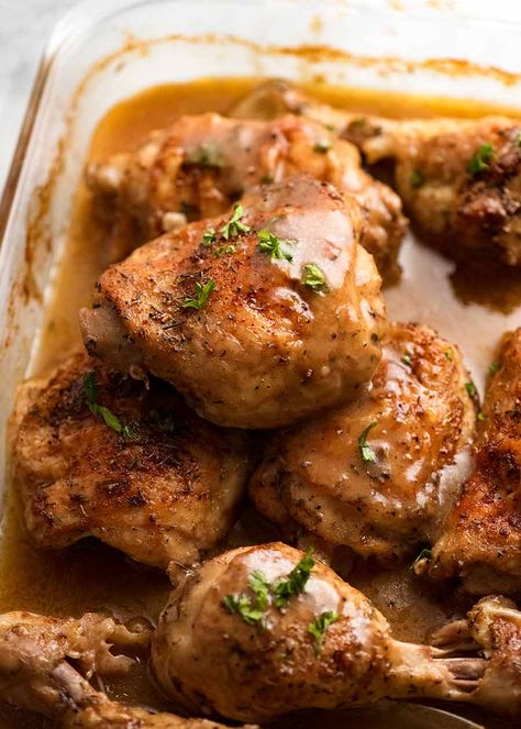 Close up of crispy baked chicken thighs and drumsticks with gravy Chicken Thighs With Gravy, Chicken With Gravy, Baked Boneless Chicken Thighs, Herbed Chicken, Chicken Gravy Recipe, Broccoli Fritters, Oven Baked Chicken Thighs, Chicken Breast Crockpot Recipes, Chicken Drumstick