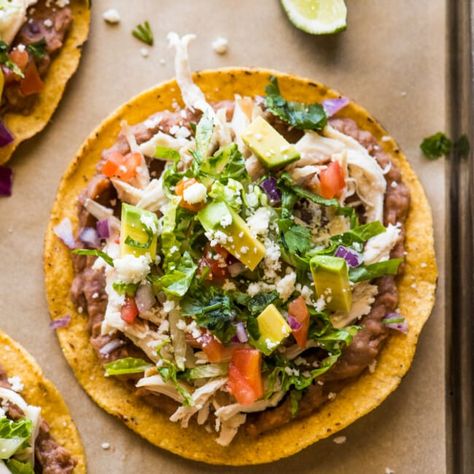 These chicken tostadas are a quick and easy weeknight dinner! Made with crispy tostada shells, shredded chicken, refried beans, and all the best toppings. Tostada Shells, Tostada Recipe, Tostadas Recipe, Isabel Eats, Canning Refried Beans, Tostada Recipes, Homemade Refried Beans, Chicken Tostadas, Homemade Tortillas