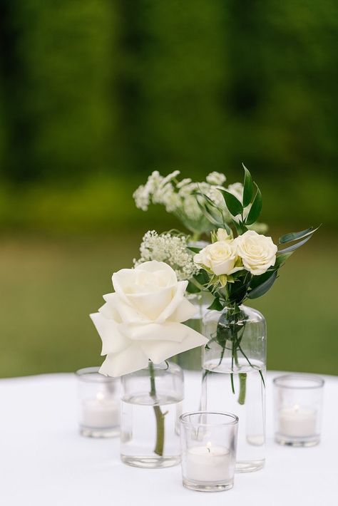 White and green florals in clear glass for a simple and beautiful cocktail centerpiece. Photo by Holcomb and Co. White And Green Centerpieces, Cocktail Hour Centerpieces, White And Green Florals, Cocktail Table Centerpieces, Wedding Cocktail Tables, Cocktail Table Decor, Cocktail Hour Decor, White Cocktail Tables, Italian Inspired Wedding