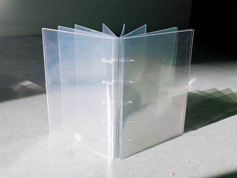 Clear laser-cut acrylic covers and Duralar acetate pages coptic-bound together with clear fishing line Clear Book, Acrylic Book Cover Design, Clear Album Cover, Plexiglass Art, Transparent Bookmark, Clear Book Portfolio Design, Clear Acrylic Sheet, Clear Paper, Glass Book