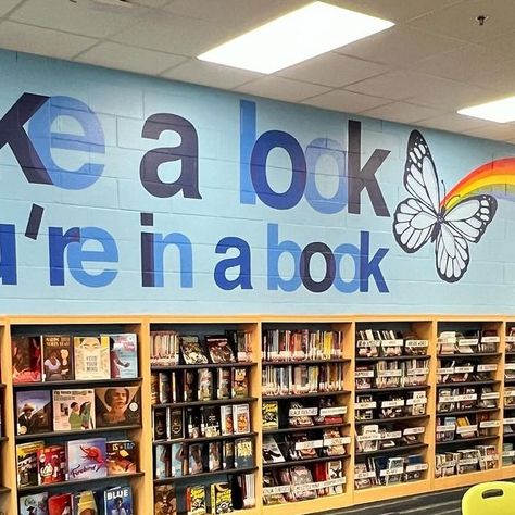 Mike on Instagram: "The final touch. Take a look, you’re in a book. 🦋 @upperwestsidemurals 🦋 #readingrainbow #library #librariesofinstagram #librarian #librariansofinstagram #bookstagram" School Librarian Aesthetic, Elementary School Librarian, Librarian Aesthetic, Library Mural, Teacher Librarian, School Librarian, Reading Rainbow, Final Touch, School Library