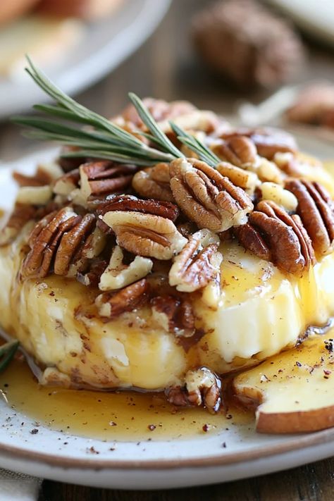 A warm and gooey Maple Pecan Baked Brie served with crackers, blending sweet and savory flavors, perfect for holiday gatherings. Maple Bacon Brie Cheese, Holiday Baked Brie Recipes, Pecan Baked Brie Recipes, Maple Pecan Brie Recipes, Maple Baked Brie, Baked Brie With Maple Syrup And Pecans, Brie Party Appetizers, Baked Brie In Puff Pastry With Brown Sugar And Pecans, Brie Melt Recipes