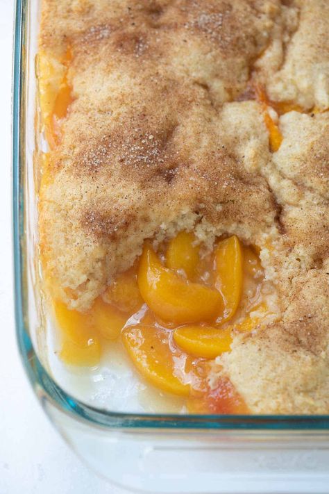 This Gluten-Free Peach Cobbler has a fluffy cake topping and is EASY to make from scratch! It can be made with fresh, frozen or canned peaches so you can enjoy it year-round. The perfect easy, gluten-free dessert for any occasion! Easy Gluten Free Peach Cobbler, Gf Peach Cobbler Recipe, Gluten Free Dairy Free Peach Cobbler, Gluten Free Cobbler Topping, Gluten Free Peach Desserts Easy, Healthy Peach Cobbler Clean Eating, Gluten Free Peach Dessert Recipes, King Author Gluten Free Recipes, Dairy Free Cobbler