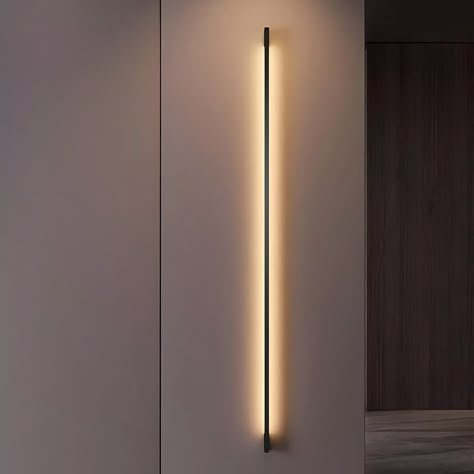 Experience the power of modern minimalism with the Modern Minimalist LED Strip Indoor Wall Sconce Lighting Wall Lamp. This sleek, contemporary fixture combines cutting-edge lighting technology with a clean, streamlined design, delivering unparalleled illumination and style.

Warm, neutral, or cool white LED lighting with 3-step dimming
Energy-efficient LED bulbs with 90+ CRI for true-to-life color
Hardwired installation in sizes from 23.6" to 94.5" to suit any space
Durable iron and acrylic construction with a modern black finish Wall Uplight, Minimalistic Lighting, Modern House Lighting, Modern Interior Lighting, Wall Sconces Living Room, Wall Lamp Modern, Sconces Living Room, Wall Lamps Living Room, Indoor Wall Sconces