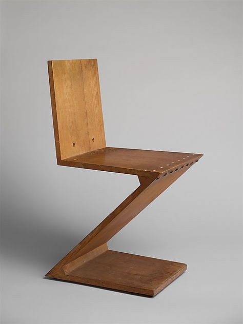 Zig Zag Stoel  Gerrit Rietveld  (Dutch, 1888–1964)  ca. 1937-40.  The Zig Zag chair is the epitome of the de Stijl ideals synthesizing form, function, and construction. Zig Zag Chair, Rietveld Chair, Gerrit Rietveld, Wooden Chairs, Iconic Furniture, Piet Mondrian, Furniture Designer, Dutch Design, Classic Furniture