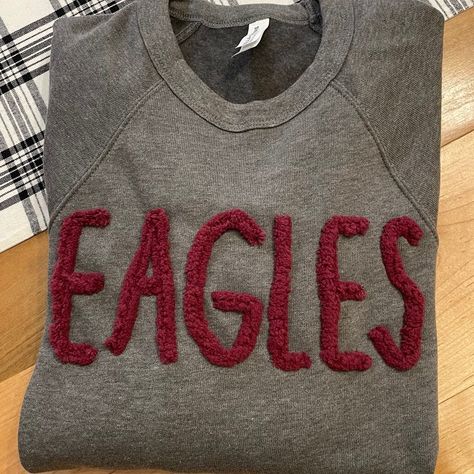 Restock alert! We just received a new shipment of all colors and sizes! Pick your favorite team or mascot & we can add it to a super soft Bella Canvas sweatshirt. Prefer a different brand…no problem. Message us & we will find your favorite brand! Chenille Letters Sweatshirt, Chenille Shirt Ideas, Diy Chenille Letter Sweatshirt, Yarn Embroidery On Sweatshirt, Yarn Letters, Booster Club, Team Sweatshirts, Sweatshirt Embroidery, School Sweatshirts