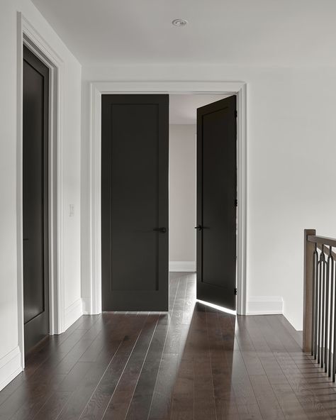 Black Door Inside, White Walls Black Doors Wood Floors, Black Walls Black Doors, Black Vs White Trim Interior, Black Interior Doors With White Trim Dark Wood Floors, Tricorn Black Sherwin Williams Interior Doors, Black Bedroom Doors White Trim, Interior Black Doors With White Trim, Charcoal Interior Doors