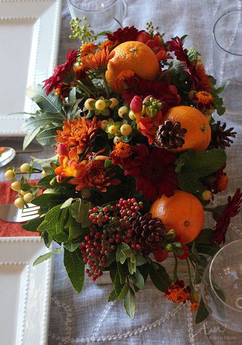 Thanksgiving Centerpiece with Oranges, Berries & Flowers flowers candles table thanksgiving centerpiece pumpkins thanksgiving decoration Fall Arrangements Diy, White Hypericum, Thanksgiving Flower Arrangements, Orange Mums, Pepper Berry, Thanksgiving Floral Arrangements, Flower Arranging Tutorial, Diy Centerpiece, Thanksgiving Floral