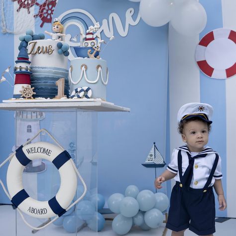 Welcome aboard 🚢 sharing some photos from 👶🏻 Zeus ⚡️ 1️⃣ birthday bash! Can’t believe how much our ray of light has grown—he’s filled our lives with so much joy and love. We went with a fun sailor ⚓️ theme for our little adventurer, who’s always diving into life with endless energy. We’re so lucky to have him in our family, and his special day was filled with so many sweet moments. Cheers to more adventures with our marine explorer, Zeus! 🐾🌊✨ #FirstBirthday #Zeus #GlamDapperFamily #sailorthem... Sailor Themed Birthday Party, Sailor First Birthday, Sailor Birthday Party Boy, Nautical 1st Birthday Boy, Nautical First Birthday Boy, Sailor Theme Party, Boat Party Theme, Anchor Birthday, Baby Boy Birthday Party