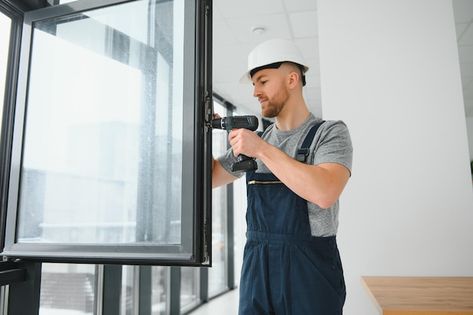 Construction worker repairing plastic wi... | Premium Photo #Freepik #photo #handyman-services #handyman #repair-man #repairman Industrial Garage Door, Energy Efficient Windows, Plastic Windows, Window Replacement, Man Photography, Modern Windows, Window Styles, Construction Worker, Sound Insulation