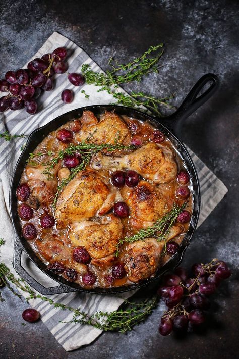 Braised Chicken with Grapes in a cast iron skillet with sprigs of thyme and grapes scattered around. Chicken With Grapes, Grape Chicken, Week Meals, Balsamic Vinegar Chicken, Autoimmune Diet, Auto Immune, Hearty Chicken, Aip Diet, Autoimmune Paleo