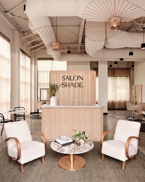 Wood Slat Wall Salon, Open Ceiling Salon, Cute Reception Desk, Open Floor Salon Ideas, Open Floor Plan Hair Salon, Salon Suites Floor Plans, Light And Airy Hair Salon, Beauty Reception Area, Spa Front Desk Reception Areas