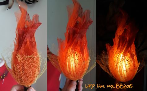 Burn, baby, burn.  Magpie Bones brings us this nifty LARP safe fire effect .  The flames are shaped organza or tulle around an LED core. It'... Sorceress Cosplay, Fake Fire, Scifi Horror, Horror Design, Anniversaire Harry Potter, Bijoux Fil Aluminium, Cosplay Tutorial, Light My Fire, Cosplay Diy