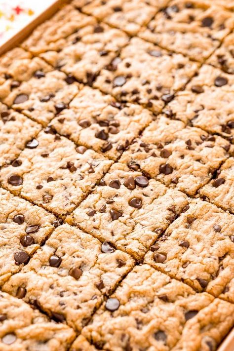 Skip the scooping and multiple batches and make Chocolate Chip Pan Cookies instead! They are tender, chewy, easy and perfect for a crowd! Made with simple ingredients like eggs, flour, butter, sugar, and of course, chocolate chips, they’re baked in a pan and cut into squares. Chocolate Chip Pan Cookies, Nestle Chocolate Chip Cookies, Choc Chip Cookie Recipe, Double Chocolate Chip Cookie Recipe, Big Chocolate Chip Cookies, Baking Chocolate Chip Cookies, Potluck Dessert, Current Recipes, Oatmeal Chocolate Chip Bars