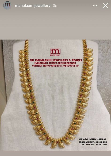 Very Light Weight New Collection Added Mango Long Haram In The Stock Studded with Ruby And Emerald. VISIT OUR SHOWROOM FOR FULL RANGE OF WEDDING COLLECTION AT WHOLESALE PRICES Please call WHATSAPP VIDEO CALL NO. 9100592011, 9652005510 www.srimahalaxmijewellers.in #SriMahalaxmiJewellers #MahalaxmiJewellers #longharam #mangolongharam #mangoharam #tradional #tradionalwear #southindian #southindianwear #bridalwear #partywear #bridaljewellery Long Mango Haram Designs Indian, Plain Haram Gold, Light Weight Gold Long Harams, Gold Mango Haram Designs With Grams, Light Weight Mango Haram Designs, Long Harams Under 40 Grams, Latest Mango Haram Designs With Grams, One Gram Gold Jewellery With Price Long Haram, Light Weight Gold Haram Designs