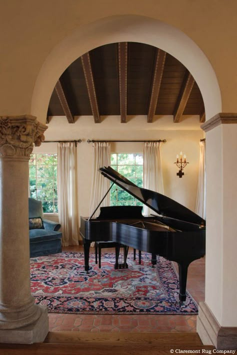 Striking Antique Serapi in Music Room  The splendor of this 120 year old Persian room size rug undoubtedly adds to the enjoyment of music played in this distinctive setting while aiding the fidelity of the sound.