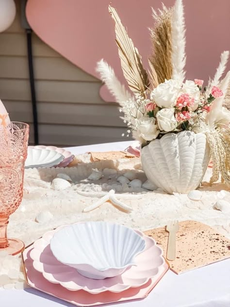 Pink Beach Theme Party, Our Little Pearl Is On The Way, Shell Party, Shell Birthday Party, Boho Beach Theme Party, Pastel Beach Party, Seashell Birthday Party Ideas, Shell Birthday Party Decorations, Seashell Party