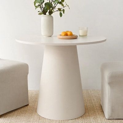 This modern round dining table is a stylish addition to your kitchen or dining area. Designed to seat four people comfortably, it's crafted from engineered wood with a clean white finish. The pedestal base adds a touch of elegance and stability to the table, while its compact size makes it a great fit for smaller spaces. With a weight capacity of 100 lbs. this table is perfect for hosting casual meals or intimate gatherings. Pair it with the dining chairs of your choice. | Wade Logan® Bradlyn Round 35" Pedestal Dining Table 29.5 H in brown / Wood in White | 29.5" H X 35" W X 35" L | Wayfair White Pedestal Dining Table, 36” Round Table, Round Dining Table White, Round Entryway Table, Eat In Kitchen Table, Small Round Dining Table, Small Dining Table Set, Round Desk, Booth Table