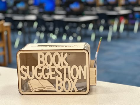 Library Book Suggestion Box Need to seek feedback from library stakeholders? Want to know what books your students or library attendees are wanting to read? This box allows anyone - students, parents, teachers, staff, etc - to make book suggestions for your library! Assembly is easy - just fit each notch into its slot - the box stays assembled without glue! You may also add wood glue for added strength, especially if working with smaller, curious children.  Options when ordering:  1) Assemble yourself 2) Let me assemble it for you  3) Birch material 4) MDF material Please allow 1-2 weeks for shipping, due to high demand. Library Themed Party, Suggestion Box Ideas, Book Store Ideas, Library Program Ideas, Mobile Bookstore, Bookstore Ideas, Tiny Library, Bookstore Design, Book Themed Party