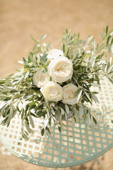 Tuscany wedding among the olive trees | La Gardenia Roses And Olive Branches, Olive Leaf Wedding Centerpieces, Gardenia Wedding Decoration, Olive Leaves Centerpiece, Olive Greenery Wedding, Olive Tree Wedding Table Decoration, Olive Wedding Centerpieces, Olive Branch Wedding Table, Olive Tree Centerpieces Wedding