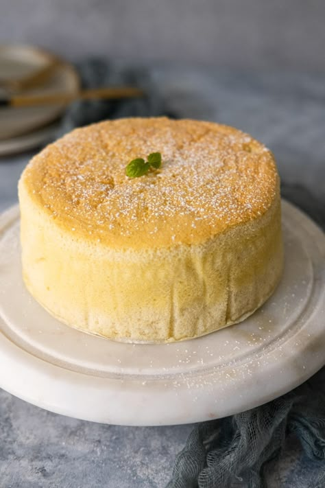 Yogurt cake placed on a white marble stand with mint leaves on top. Italian Almond Cake, Burnt Plywood Floor, Lemon Gluten Free, Vanilla Yogurt Recipes, Lemon Yogurt Cake Recipe, Yogurt Dessert Recipes, Yogurt Cake Recipe, Greek Yogurt Cake, Lemon Yogurt Cake