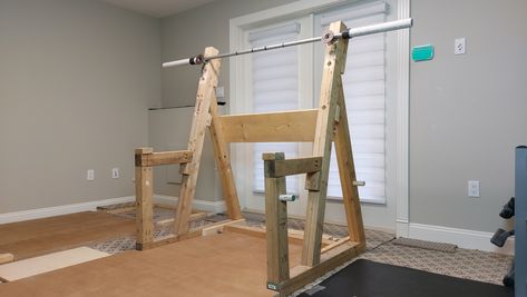 a DIY squat rack made from 2x4 lumber Diy Home Gym On A Budget, Deadlift Platform, Home Gym On A Budget, 2x4 Lumber, Diy Home Gym, Squat Rack, Garage Ideas, Home Gym Equipment, Concrete Diy