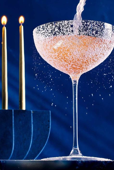 Naomi Levy’s Hebrew Hammer is a fruity, bright pink Hanukkah cocktail that uses framboise to mimic the flavors of sufganiyot, Israeli doughnuts. #cocktails#cocktailrecipes#drinks#drinkideas#drinkrecipes#drinkalcoholrecipes #holidayrecipes #holidaycocktails #hanukkahcocktails #vodkacocktails Hanukkah Cocktails, Chanukah Cocktails, Fig Syrup, Simple Syrup Cocktails, Whiskey Smash, Clear Fruit, Sweet Bourbon, Hanukkah Party, Jelly Doughnuts