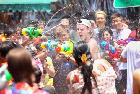 Tourists shooting water guns and having fun at Songkran festival, the traditional Thai New Year, on Khao San Road in Bangkok, Thailand. Thailand New Year, Mexico Activities, Thai Aesthetic, Thai Market, Thai New Year, World Festivals, Water Festival, Khao San Road, Creative Advertising Photography