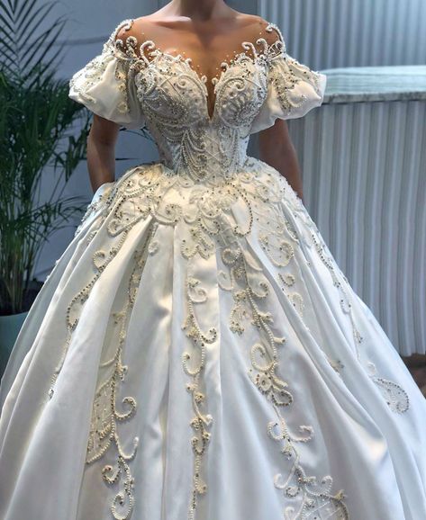 This short sleeve #bridal gown has poofy #sleeves.  The sheer upper bodice gives an off the shoulder look.  You can have #custom #ballgowns like this made special for your #wedding.  In addition to made to order #dresses we can also make #replicas of #couture #fashion #designs for less than the original.  So if your dream #dress is over your budget we can help.  For pricing and more details on how we work with long ditances #brides email FASHION@DARIUSCORDELL.COM . Wedding Dresses Poofy, Dresses Poofy, Poofy Wedding Dress, Fluffy Wedding Dress, Poofy Sleeves, Wedding Dresses High Low, Short Sleeve Wedding Dress, Princess Bridal Gown, Long Train Wedding Dress