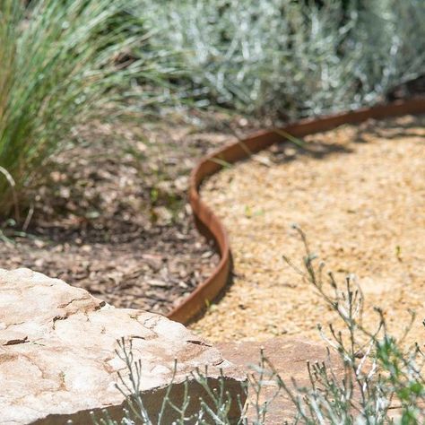 John Leathart on Instagram: "A blending of textures - a meshing of materials. Constructing this @spherelandscapedesign garden took us to our happy place using @adelaidehillssandstone stone, @eghollard Corten steel edging and recycled red bricks. @longshotimages capturing the details with her usual style!" Garden Corten Steel, Corten Steel Edging Landscape, Steel Garden Edging Ideas, Steel Edge Landscape, Cottage Garden Edging Ideas, Corten Edging Garden, Recycled Brick Garden Edging, Garden Path Edging, Corten Steel Garden Edging