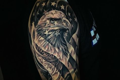 79 Filler Tattoo Design Ideas – [2021 Inspiration Guide] Eagle Tattoo With American Flag, Patriotic Eagle Tattoo Men, Mens Eagle Tattoo Arm, Eagle Carrying Flag Tattoo, Minute Man Tattoo, Eagle Flag Tattoo Men, Eagle Tattoo Designs Men Arm, Mens American Flag Tattoo Shoulder, Mens Coverup Tattoo Ideas